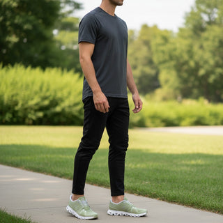 FWSports Shoes On Cloud 6 Waterproof sneakers in grass green worn by a man in a park setting