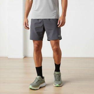 FWSports Shoes Hoka Bondi 8 men's running shoes in olive haze and mercury with cushioned foam soles on a runner.