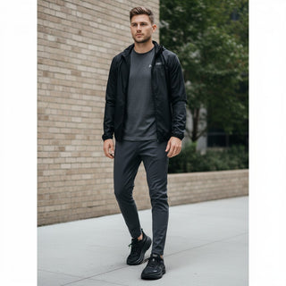 FWSports Shoes model wearing black Hoka Bondi 9 running shoes with plush cushioning and mesh upper on a city sidewalk
