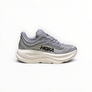 FWSports Shoes women's Hoka Bondi 9 running shoe in grey with a thick white cushioned midsole and mesh upper.