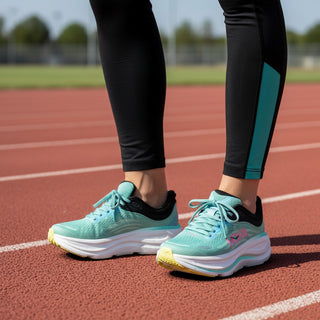 FWSports Shoes Hoka Bondi 9 women's running shoes in green and light blue on a red track with black leggings