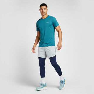 FWSports Shoes model wearing light blue and orange Hoka Bondi 9 running shoes with athletic apparel