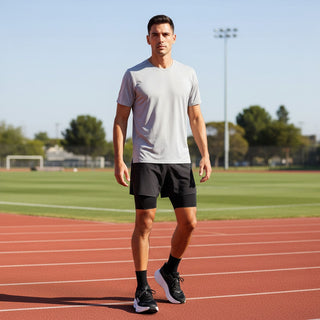 FWSports Shoes model wearing black and white Hoka Bondi 9 running shoes on an outdoor athletics track