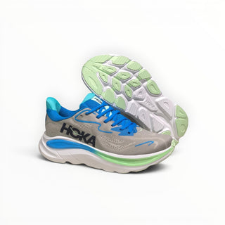 FWSports Shoes Womens Hoka Clifton 10 running shoe in grey and blue with a thick cushioned midsole and rubber outsole.