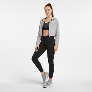 FWSports Shoes model wearing grey Hoka Clifton 10 running shoes with black leggings and a grey cropped jacket