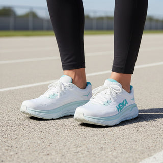 FWSports Shoes Hoka Clifton 10 women's running shoes in light blue and white on a track