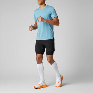 FWSports Shoes model wearing white and orange Hoka Clifton 10 running shoes with breathable mesh and thick cushioning.