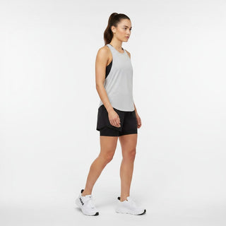 FWSports Shoes model wearing white Hoka Clifton 10 running shoes with black accents in a studio setting
