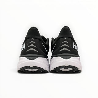FWSports Shoes Hoka Clifton 8 running shoes in black and white, showing the rear view with flared heel collar and logo.