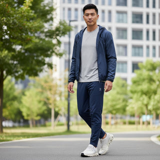 Man wearing FWSports Shoes On Cloud 6 Waterproof beige sneakers while walking on a city path