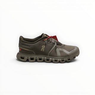 FWSports Shoes On Cloud 6 waterproof running shoes in black and gold with a mesh upper and cushioned rubber sole.