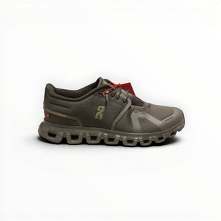 FWSports Shoes On Cloud 6 waterproof running shoes in black and gold with a durable mesh upper and cushioned sole.