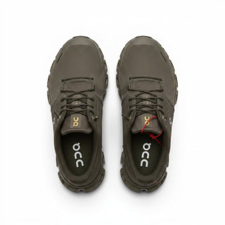 FWSports Shoes On Cloud 6 waterproof sneakers in black and gold with a durable mesh upper and cushioned sole.