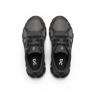 FWSports Shoes On Cloud 6 waterproof sneakers in black and gray with a top-down view of the mesh upper and laces.