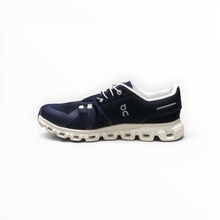 FWSports Shoes On Cloud 6 waterproof running shoe in navy blue and white with a cushioned sole and mesh upper.