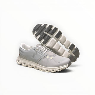 FWSports Shoes Womens On Cloud 6 Waterproof sneakers in glacier grey with a durable mesh upper and lugged rubber outsole.