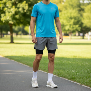 FWSports Shoes On Cloud 6 waterproof sneakers in off-white worn by a man in athletic gear on a park path