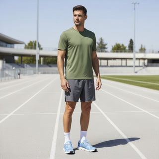 FWSports Shoes On Cloud 6 waterproof sneakers in light gray-blue and white worn by a man on a running track