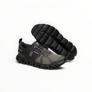 FWSports Shoes On Cloud 6 waterproof sneakers in black and gray with a durable lugged outsole for traction.