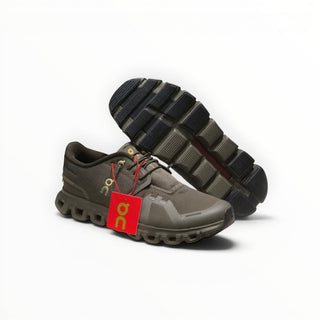 FWSports Shoes On Cloud 6 waterproof sneakers in black and gold with a rugged rubber outsole and red brand tag