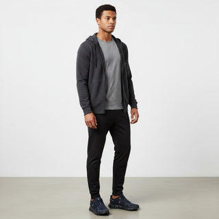 FWSports Shoes On Cloud 6 waterproof sneakers in black and deep blue worn by a man in casual athletic clothing