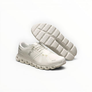 FWSports Shoes On Cloud 6 waterproof sneakers in white with a textured mesh upper and durable rubber lug outsole.