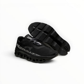 FWSports Shoes On Cloudmonster men's running shoes in black and silver with breathable mesh and thick CloudTec sole.