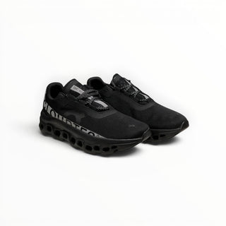FWSports Shoes On Cloudmonster men's running shoes in black and silver with breathable mesh and thick CloudTec sole.