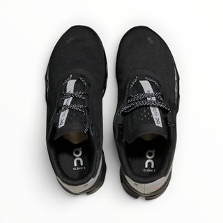 FWSports Shoes On Cloudmonster men's running shoes in black and silver with breathable mesh and cushioned collar.
