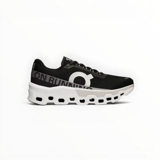 FWSports Shoes On Cloudmonster men's running shoes in black and white with breathable mesh and thick CloudTec cushioning.