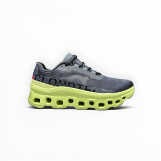 FWSports Shoes On Cloudmonster men's running shoe in black and acacia yellow with thick CloudTec cushioned midsole.