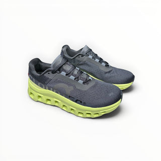 FWSports Shoes On Cloudmonster men's running shoes in black mesh with a vibrant acacia yellow CloudTec midsole.