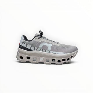 FWSports Shoes On Cloudmonster men's running shoes in Cinder Ash with breathable mesh and thick CloudTec cushioning.