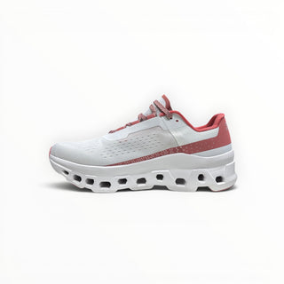 FWSports Shoes On Cloudmonster women's running shoe in gem red and white with oversized CloudTec cushioning.