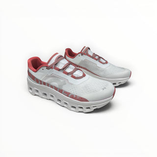 FWSports Shoes On Cloudmonster women's running shoes in white and gem red with oversized CloudTec cushioning.