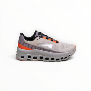 FWSports Shoes On Cloudmonster men's running shoes in gray and orange with breathable mesh and thick CloudTec cushioning.