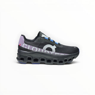 FWSports Shoes On Cloudmonster women's running shoe in black with purple and blue accents and thick CloudTec sole.