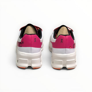 FWSports Shoes On Cloudmonster women's running shoes in undyed white and aurora pink, rear view showing CloudTec sole.