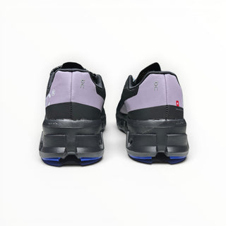 Rear view of FWSports Shoes On Cloudmonster women's running shoes in black, purple, and blue with thick CloudTec soles.