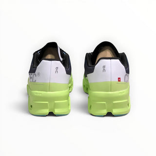 FWSports Shoes On Cloudmonster running shoes in iron black and neon green, showing the rear heel view and branding.
