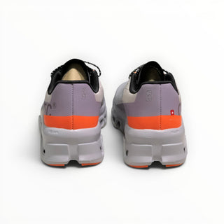 FWSports Shoes On Cloudmonster men's running shoes in gray and orange with thick CloudTec cushioning, rear view.