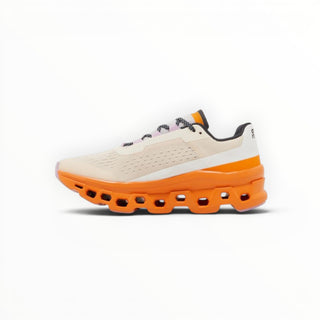 FWSports Shoes On Cloudmonster women's running shoes in yellowish white and orange with thick CloudTec cushioning.