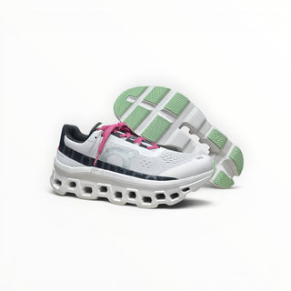 FWSports Shoes On Cloudmonster men's running shoes in white with lima bean green soles and pink laces.