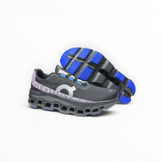 FWSports Shoes On Cloudmonster women's running shoes in black, purple, and blue with breathable mesh and CloudTec sole.