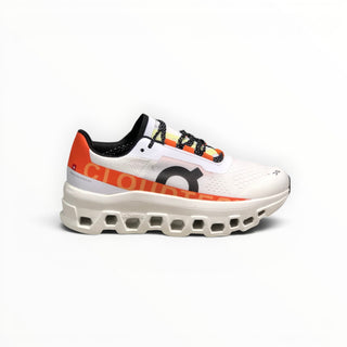 FWSports Shoes On Cloudmonster women's running shoes in white and orange with breathable mesh and thick CloudTec sole.