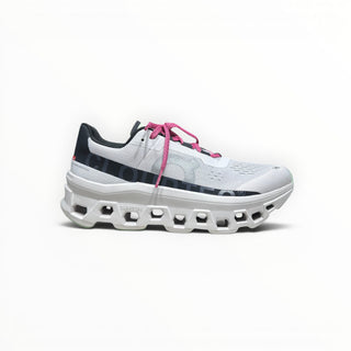 FWSports Shoes On Cloudmonster men's running shoes in white with pink laces and thick CloudTec cushioned sole.