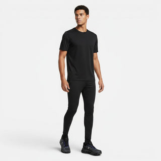 FWSports Shoes model wearing black athletic apparel and black and blue On-Run Cloudtilt sneakers