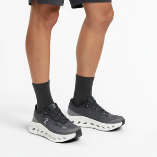 FWSports Shoes Mens On-Run Cloudtilt sneakers in black, gray, and white with breathable mesh and rocker sole.