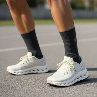 FWSports Shoes Mens On-Run Cloudtilt sneakers in light gray and yellow with mesh upper and rocker sole on track