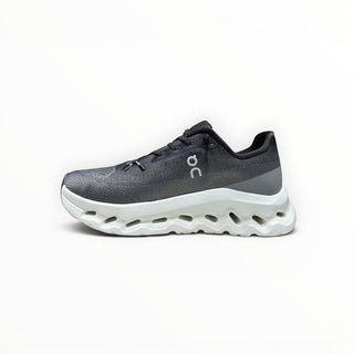 FWSports Shoes Mens On-Run Cloudtilt sneaker in black, gray, and white with a thick cushioned rocker sole.